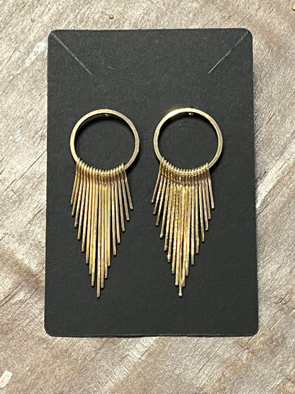 Gold earrings with dangling gold