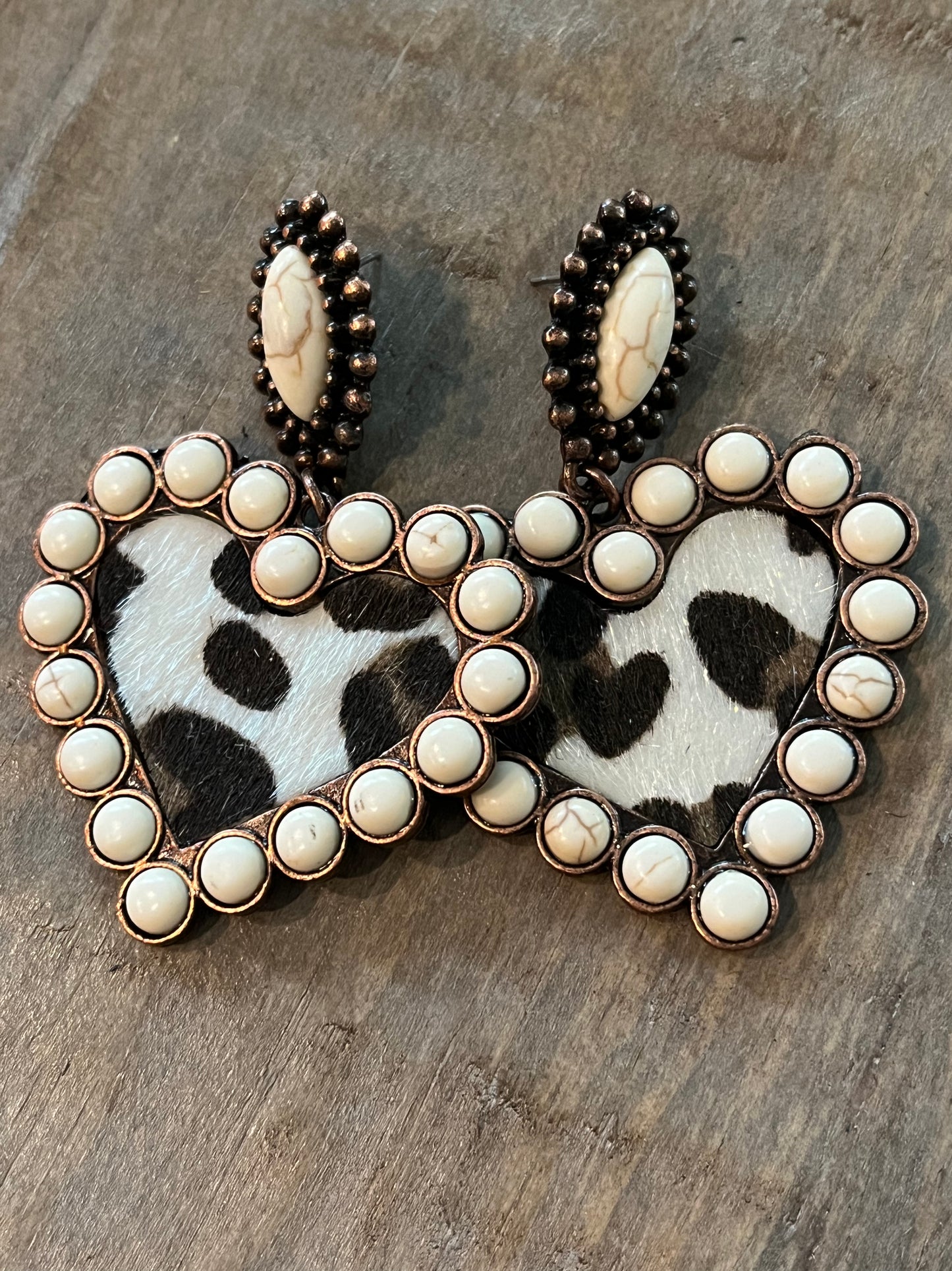 Heart shaped earrings with cream colored beading and leopard print