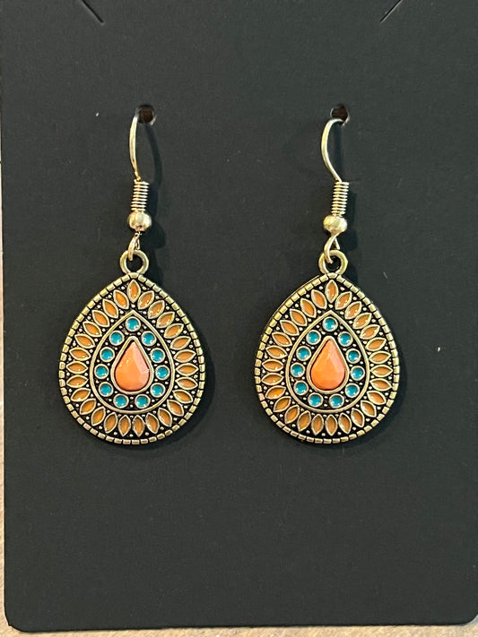 Vintage gold colored drop earrings with orange and turquoise detail