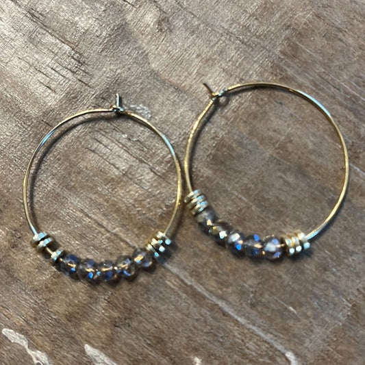 Gold hoop earrings with bead detail