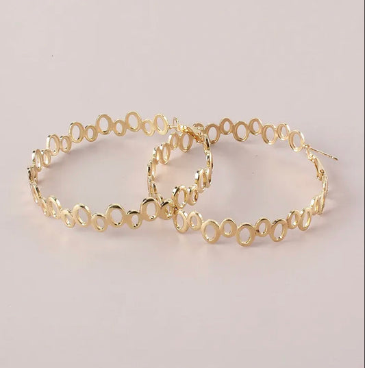 Large uneven oval geometric gold hoop earrings