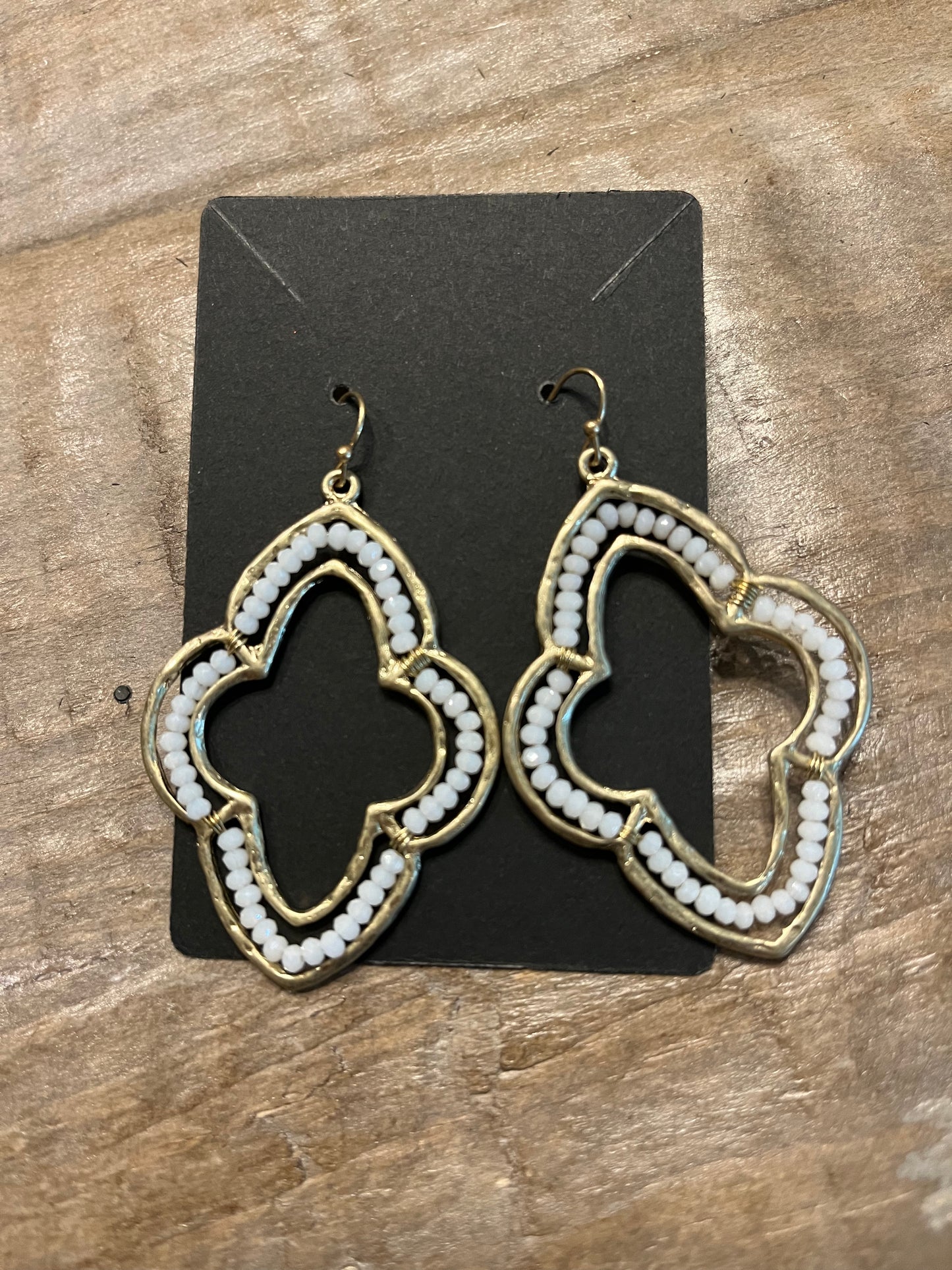 Gold Moroccan quatrefoil shaped dangle earrings with white beads