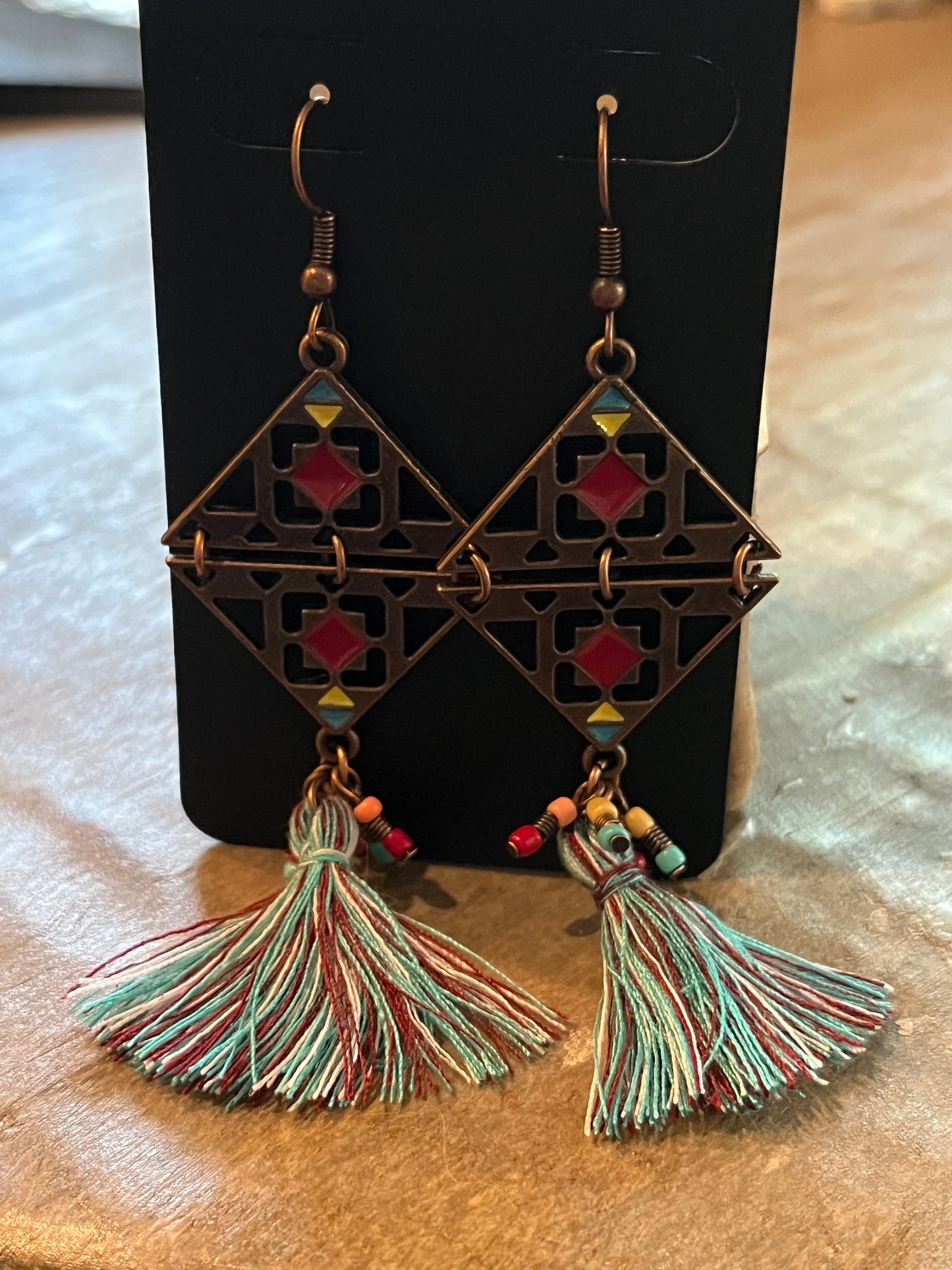 Copper drop earrings with beaded and multicolored thread tassel