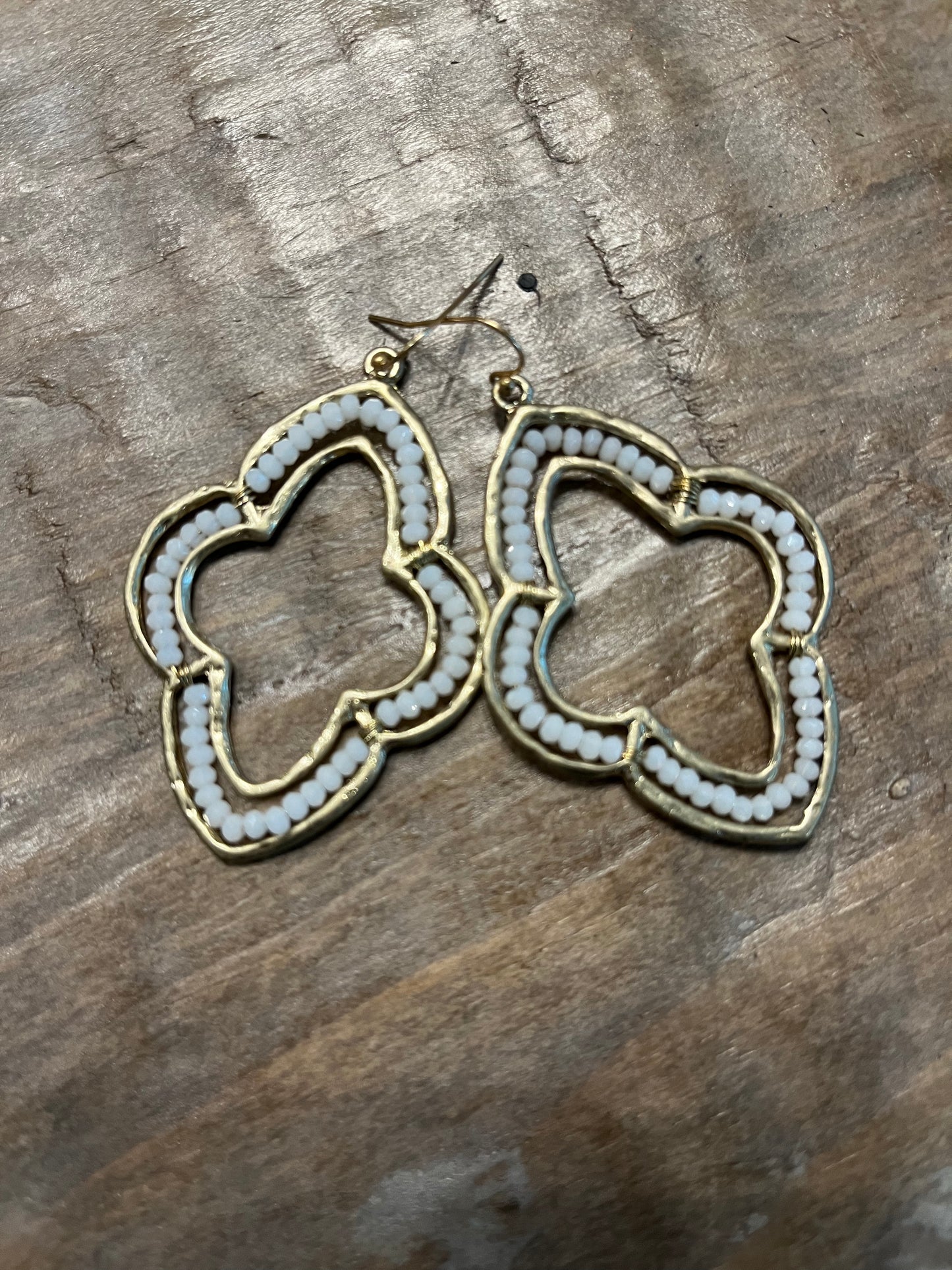 Gold Moroccan quatrefoil shaped dangle earrings with white beads