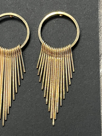 Gold earrings with dangling gold