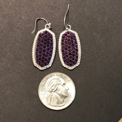 Silver earrings with purple stone inlay