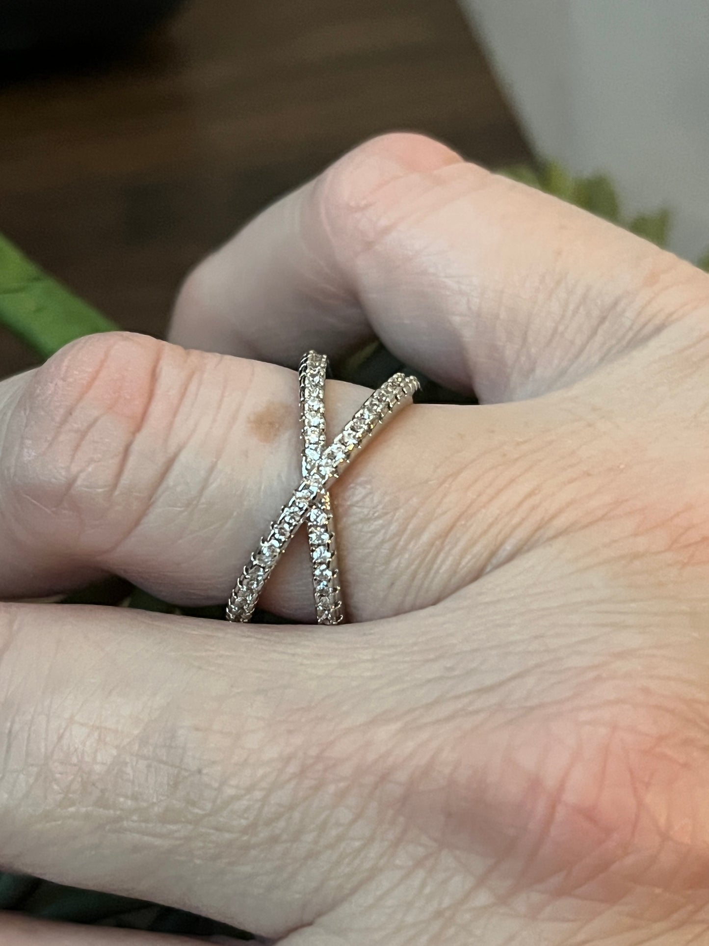 Elegant Crossover ring with CZ inlay