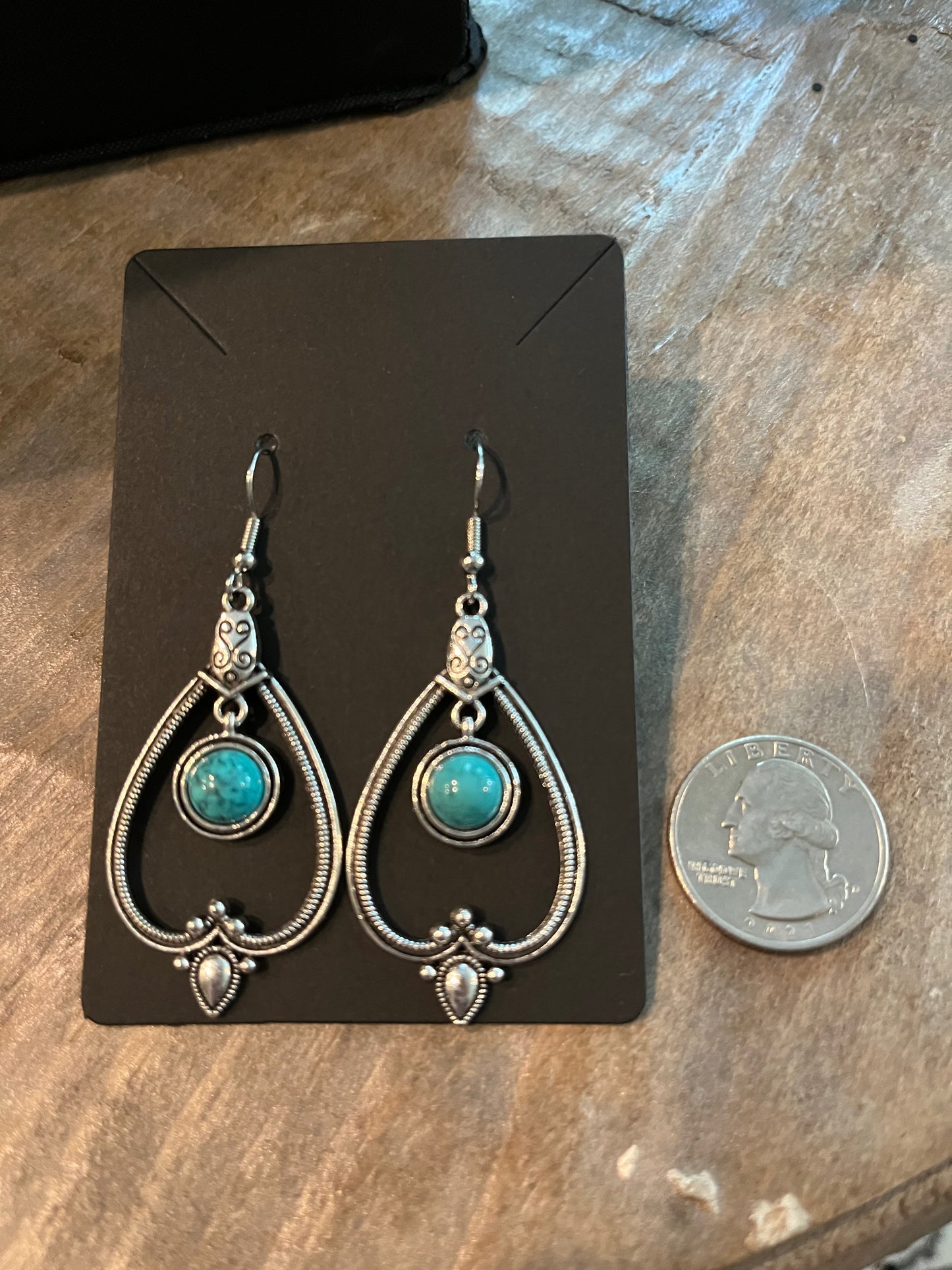 Drop Southwestern silver earrings with turquoise stone